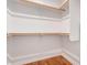 Well-organized walk-in closet featuring hardwood floors, shelving and rods at 3131 N Central Ave # 7002, Phoenix, AZ 85012