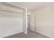 Bedroom featuring a closet with shelving and a door, offering ample storage and access at 3222 W Marshall Ave, Phoenix, AZ 85017