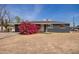 Charming single-story home featuring a dark gray brick exterior and a well-manicured front yard at 3222 W Marshall Ave, Phoenix, AZ 85017