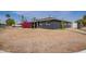 Charming single-story home featuring a dark gray brick exterior and a well-manicured front yard at 3222 W Marshall Ave, Phoenix, AZ 85017