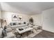 Bright living room with a modern design, featuring neutral furniture and decor at 3222 W Marshall Ave, Phoenix, AZ 85017