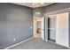 Neutral bedroom with grey walls, plush carpet, and a double-door closet at 3339 W Mohawk Ln, Phoenix, AZ 85027