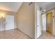 Inviting entryway with tile flooring, neutral walls, and a coat closet at 3339 W Mohawk Ln, Phoenix, AZ 85027