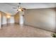 Open living room with tile flooring, neutral walls, and a vaulted ceiling at 3339 W Mohawk Ln, Phoenix, AZ 85027