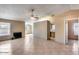 Large open living area with tile flooring, fireplace, and neutral paint scheme at 3339 W Mohawk Ln, Phoenix, AZ 85027