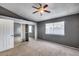 Main bedroom with a ceiling fan, carpet floor, and mirrored closet doors at 3339 W Mohawk Ln, Phoenix, AZ 85027