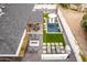 Stunning aerial view of the backyard featuring a pool, fire pit, covered dining, and multiple lounge areas for relaxation and entertainment at 3619 N 87Th St, Scottsdale, AZ 85251