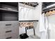 Well-organized walk-in closet with ample shelving, hanging space, and modern gray cabinetry for optimal storage at 3619 N 87Th St, Scottsdale, AZ 85251