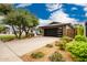 Stylish home with a spacious driveway, modern garage door, and beautifully landscaped front yard, creating an inviting entrance at 3619 N 87Th St, Scottsdale, AZ 85251