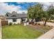 Charming single-story home boasting a well-manicured lawn and inviting front patio area with stylish outdoor furniture at 3619 N 87Th St, Scottsdale, AZ 85251