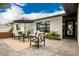 Charming front patio with modern outdoor furniture and tasteful decor, perfect for enjoying the outdoors and entertaining guests at 3619 N 87Th St, Scottsdale, AZ 85251