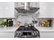 Close up of a modern kitchen featuring stainless steel appliances, white countertops, and stylish backsplash at 3619 N 87Th St, Scottsdale, AZ 85251