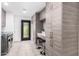 Stylish laundry room features ample cabinet space, seating, and a convenient exterior door at 3619 N 87Th St, Scottsdale, AZ 85251