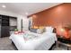 Spacious main bedroom with colorful accent wall, walk-in closet, and stylish decor, creating a relaxing retreat at 3619 N 87Th St, Scottsdale, AZ 85251