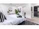 Bright and airy main bedroom features modern decor, a large bed, and stylish furnishings at 3619 N 87Th St, Scottsdale, AZ 85251