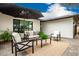 Cozy outdoor patio featuring comfortable seating, elegant decor, and a welcoming ambiance for relaxation and entertainment at 3619 N 87Th St, Scottsdale, AZ 85251