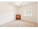 Cozy bedroom with neutral carpet, ceiling fan, and window for natural light at 3830 E Lakewood Pkwy # 2162, Phoenix, AZ 85048