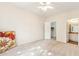 Light-filled bedroom with ceiling fan, walk in closet and an adjacent bathroom at 3830 E Lakewood Pkwy # 2162, Phoenix, AZ 85048