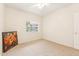 Bright bedroom featuring neutral carpet, a ceiling fan, and a window with a view at 3830 E Lakewood Pkwy # 2162, Phoenix, AZ 85048