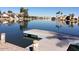 Dock with calm water and waterfront properties, creating a serene and inviting atmosphere at 3830 E Lakewood Pkwy # 2162, Phoenix, AZ 85048