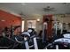 Well-equipped gym featuring modern cardio machines and weight training equipment in a clean, spacious setting at 3830 E Lakewood Pkwy # 2162, Phoenix, AZ 85048