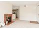 Inviting living room with fireplace, neutral carpet and view into the kitchen at 3830 E Lakewood Pkwy # 2162, Phoenix, AZ 85048