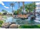 Community waterfall with the 'Lakewood' sign and lush greenery with a bright blue sky in the background at 3830 E Lakewood Pkwy # 2162, Phoenix, AZ 85048