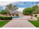 Private backyard with a large swimming pool, mature trees, and a spacious patio area for entertaining at 4010 N 156Th Ln, Goodyear, AZ 85395