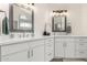 Bathroom features dual vanities, white cabinets, and modern fixtures at 4010 N 156Th Ln, Goodyear, AZ 85395