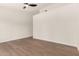 Bedroom featuring hardwood floors and ceiling fan at 4010 N 156Th Ln, Goodyear, AZ 85395