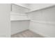 Walk-in closet with shelving and carpeted floor at 4010 N 156Th Ln, Goodyear, AZ 85395
