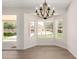 Elegant dining area offering natural light and a view of the backyard pool area at 4010 N 156Th Ln, Goodyear, AZ 85395