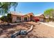 Inviting single-Gathering home featuring desert landscaping and a decorative stone walkway at 4010 N 156Th Ln, Goodyear, AZ 85395