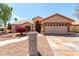 Charming single-story home with a well-manicured front yard and inviting curb appeal at 4010 N 156Th Ln, Goodyear, AZ 85395
