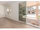 Bright living room features hardwood floors and a sliding glass door to the outdoor pool area at 4010 N 156Th Ln, Goodyear, AZ 85395