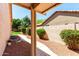 View of the side yard featuring desert landscaping and a concrete walkway at 4010 N 156Th Ln, Goodyear, AZ 85395