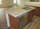 Kitchen island with stainless steel sink and dishwasher at 41246 N Vine Ave, San Tan Valley, AZ 85140