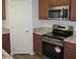 Stainless steel oven with granite countertops and wood cabinets at 41246 N Vine Ave, San Tan Valley, AZ 85140
