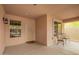 Cozy covered back patio features outdoor seating and a secure screen door for relaxed outdoor living at 4433 W Phalen Dr, Phoenix, AZ 85087