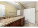 Bathroom featuring a granite countertop, tile floors, and a vanity with dark wood cabinets at 4433 W Phalen Dr, Phoenix, AZ 85087