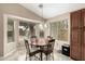 Bright breakfast nook featuring tile floors, a round table, and natural light from the surrounding windows at 4433 W Phalen Dr, Phoenix, AZ 85087