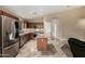 Modern kitchen with stainless steel appliances, granite counters, tile backsplash, and a center island at 4433 W Phalen Dr, Phoenix, AZ 85087