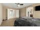 Comfortable main bedroom with double door entry into a large walk-in closet and ensuite bathroom at 4433 W Phalen Dr, Phoenix, AZ 85087