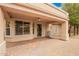 Spacious covered patio featuring brick pavers and a view of the backyard, perfect for outdoor living at 4433 W Phalen Dr, Phoenix, AZ 85087