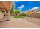 Covered patio featuring brick pavers and a seating area with a view of the backyard at 4433 W Phalen Dr, Phoenix, AZ 85087