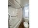 Bathroom featuring corner shower with marble-patterned surround and a toilet next to window at 457 S Jaspar Dr, Apache Junction, AZ 85119