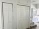 An eye-level view of bi-fold closet doors, stairs, and entrance door at 457 S Jaspar Dr, Apache Junction, AZ 85119