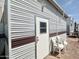 A charming exterior featuring a white door, white chairs, and brown trim accents at 457 S Jaspar Dr, Apache Junction, AZ 85119