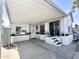 Exterior view of a manufactured home with a covered carport and easy access sliding glass door at 457 S Jaspar Dr, Apache Junction, AZ 85119