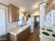 Functional kitchen with wood cabinets and white appliances at 457 S Jaspar Dr, Apache Junction, AZ 85119